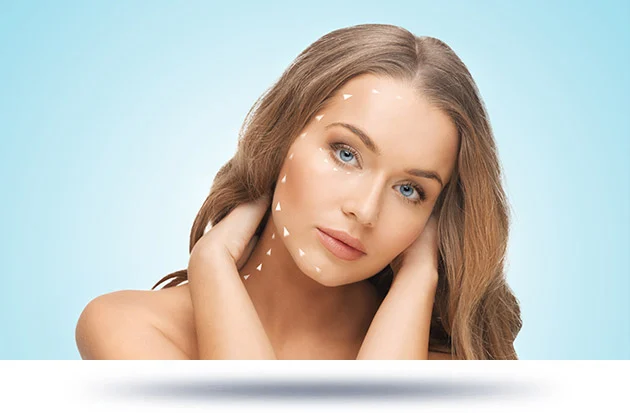 A woman with a light blue background, possibly related to a cosmetic or medical procedure, such as buccal fat pad removal.