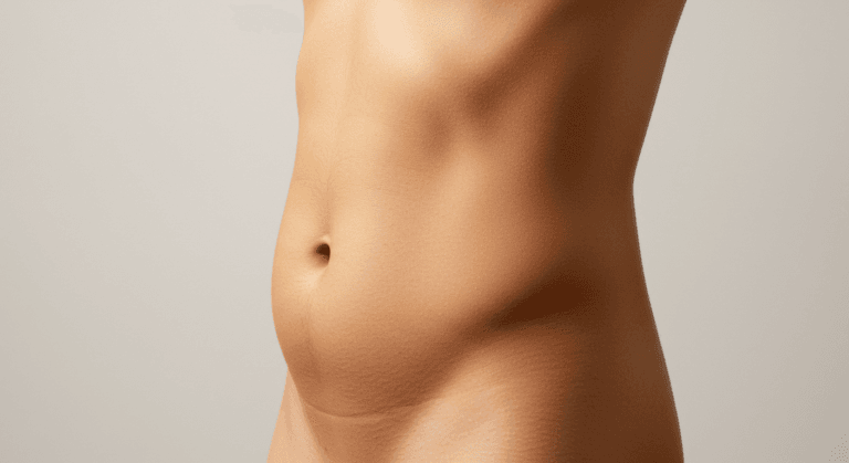 A close-up image of a person's torso, highlighting the abdominal area against a plain background.